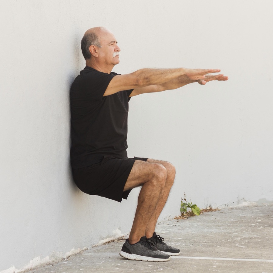 Man stretching outdoors before a workout